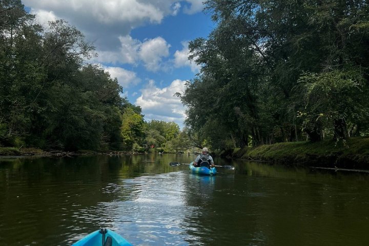 two kayaks rowing in a river