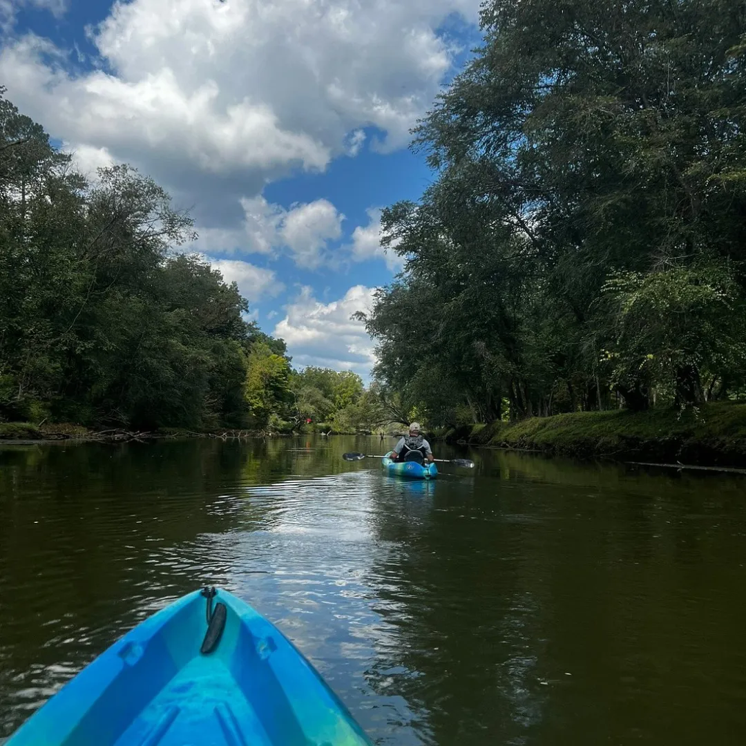 two kayaks rowing in a river